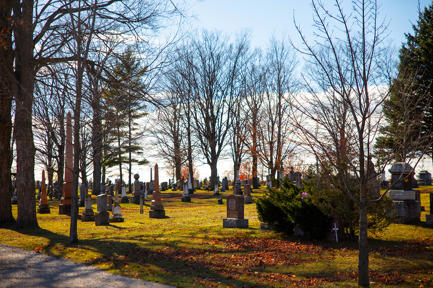 The Kincardine Cemetery in the fall under a blue sky.