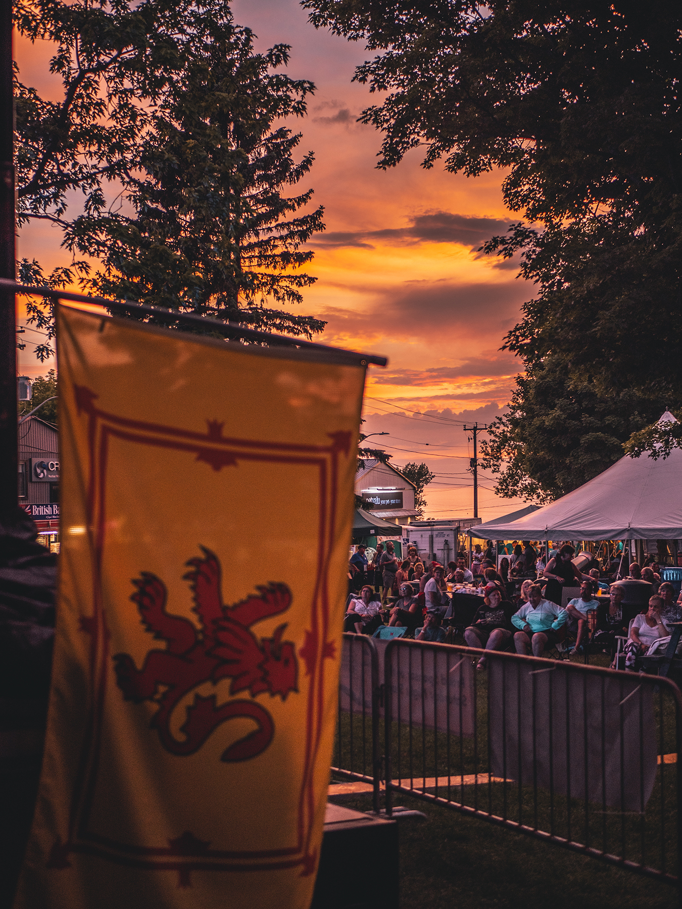 A Scottish flag in the foreground of an audience at Kincardine's Scottishfest.